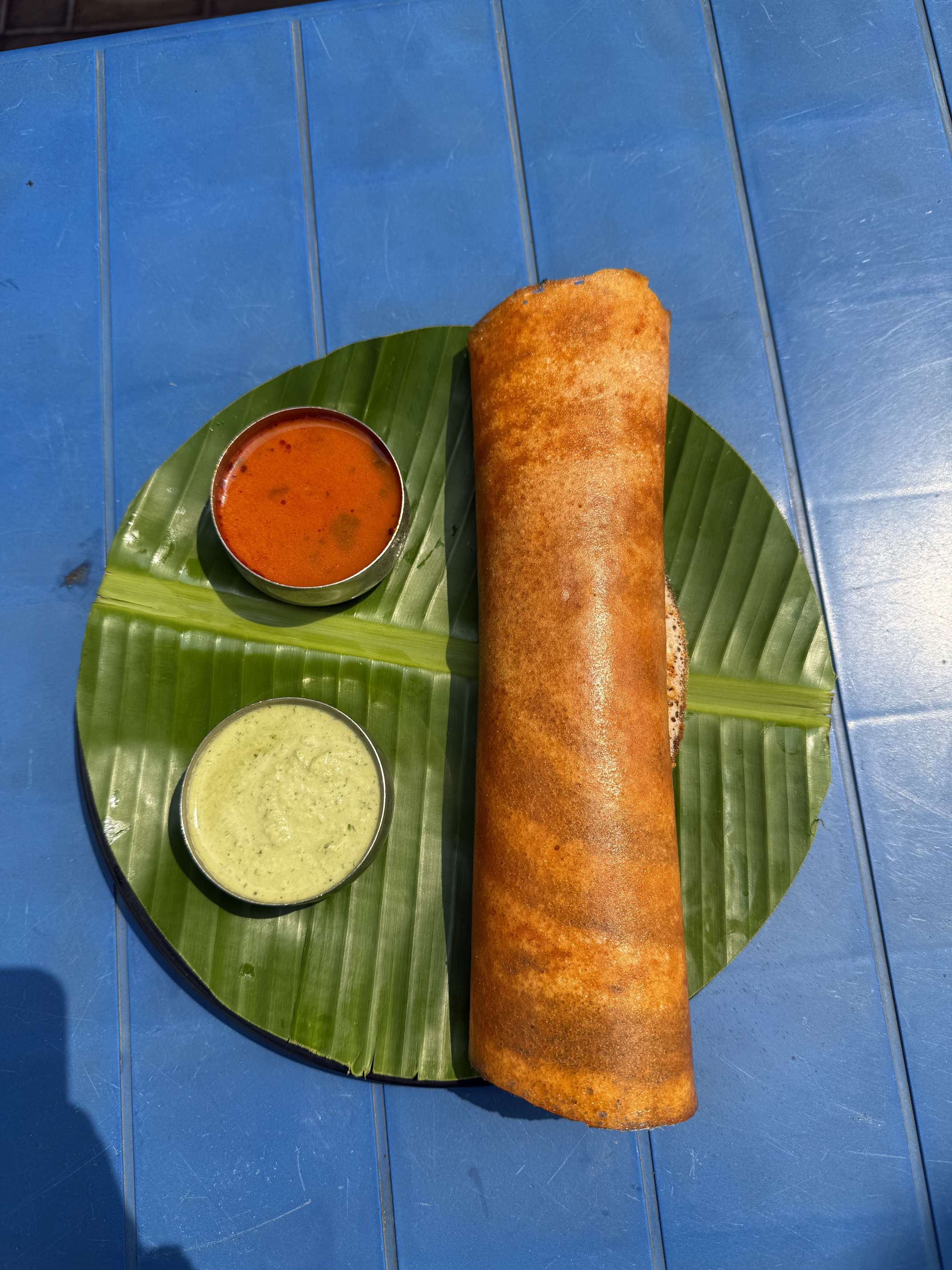 Crispy masala dosa served with chutney and sambar